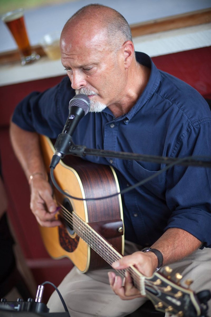Jeff McRae playing acoustic guitar